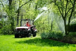 Skeeter Beater service truck and equipment in a Libertyville neighborhood yard